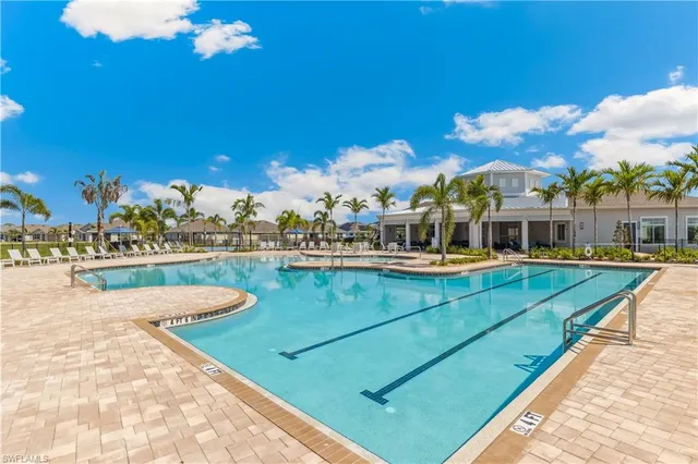 a view of a swimming pool with a deck