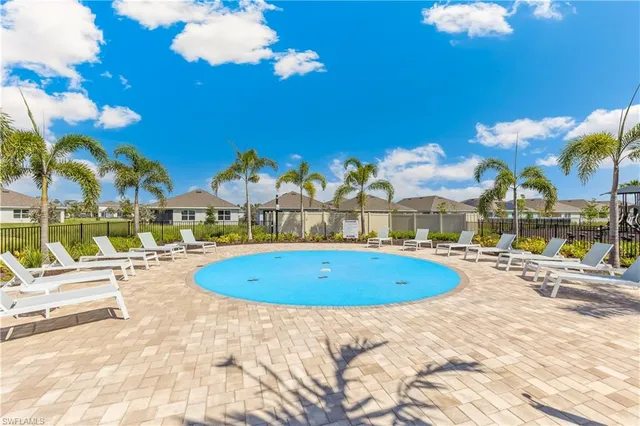 a view of swimming pool with outdoor seating