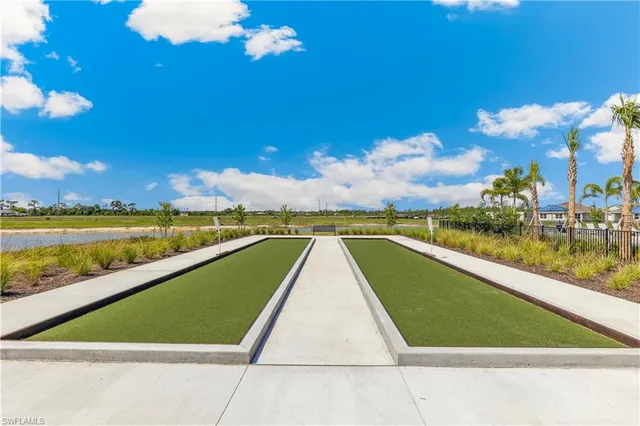 a view of swimming pool with lounge chair