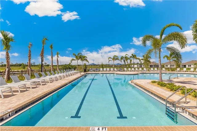 a view of swimming pool with chairs