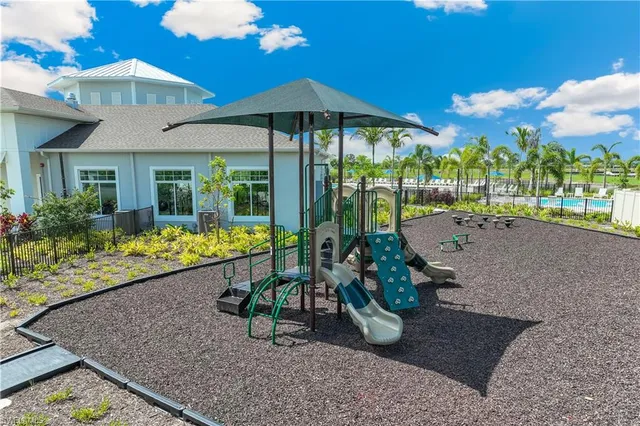 a view of a house with porch and garden