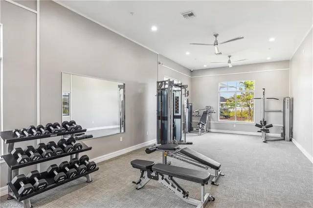 a room with gym equipment and a large window