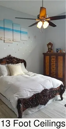 a bedroom with a bed and dresser