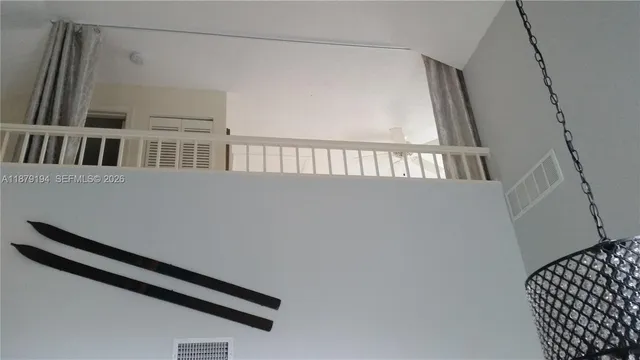 a view of swimming pool with outdoor seating and a potted plant