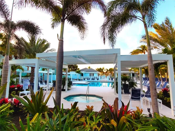 a view of a room with furniture and a window