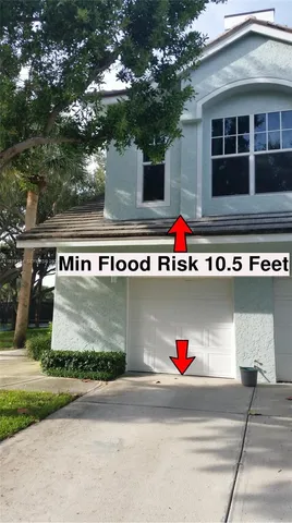 a kitchen with stainless steel appliances granite countertop a sink a refrigerator and a stove