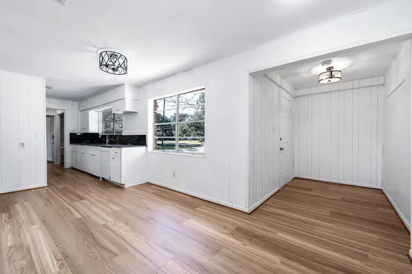 a view of a kitchen with closet and wooden floor
