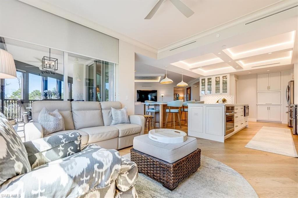 445 Cove Tower Drive, Unit 302 Naples, FL 34110 - Photo 12 of 50 Family Room / Dining Room