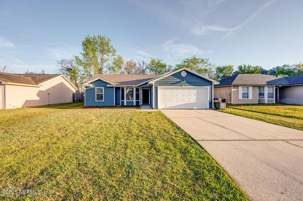 front view of a house with a small yard