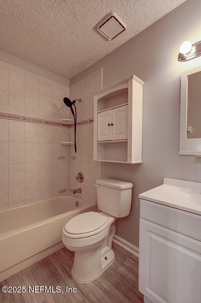 3248 Dowitcher Lane Orange Park, FL 32065 - Photo 15 of 23 a bathroom with a toilet a sink and bathtub