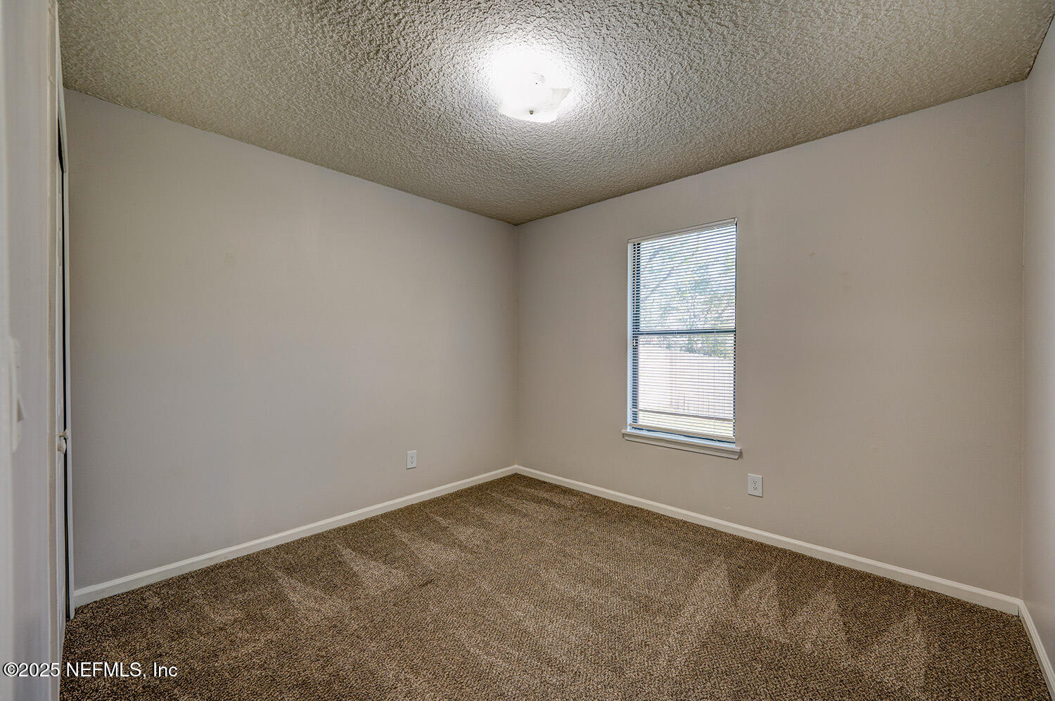 3248 Dowitcher Lane Orange Park, FL 32065 - Photo 19 of 23 an empty room with a window