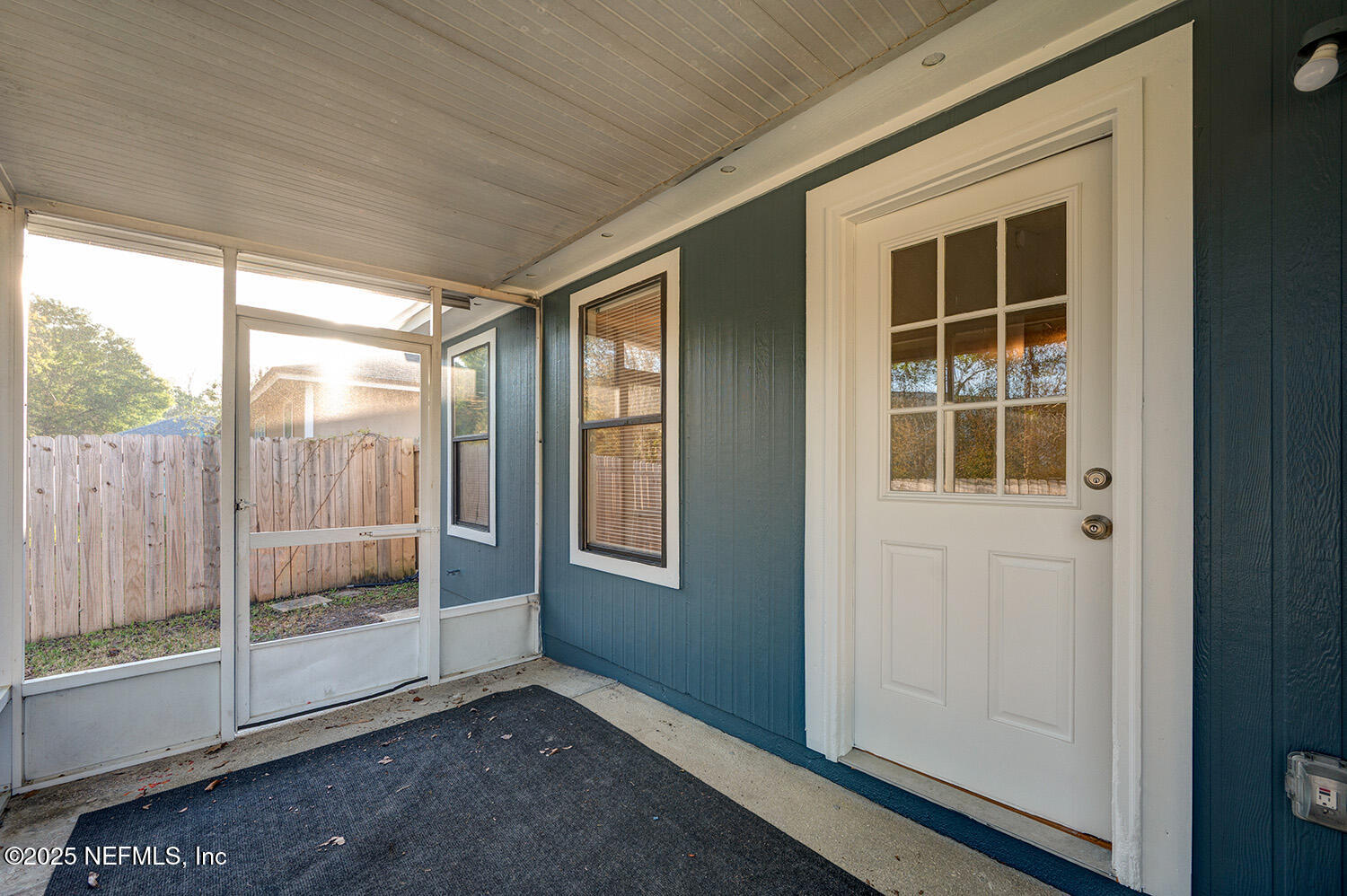 3248 Dowitcher Lane Orange Park, FL 32065 - Photo 20 of 23 a view of an empty room with wooden floor and windows