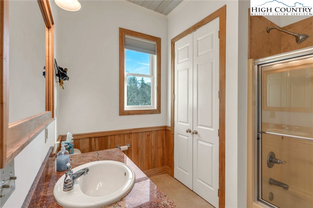 933 Thunder Ridge Lane Lenoir, NC 28645 - Photo 24 of 45 a bathroom with a sink a toilet and shower