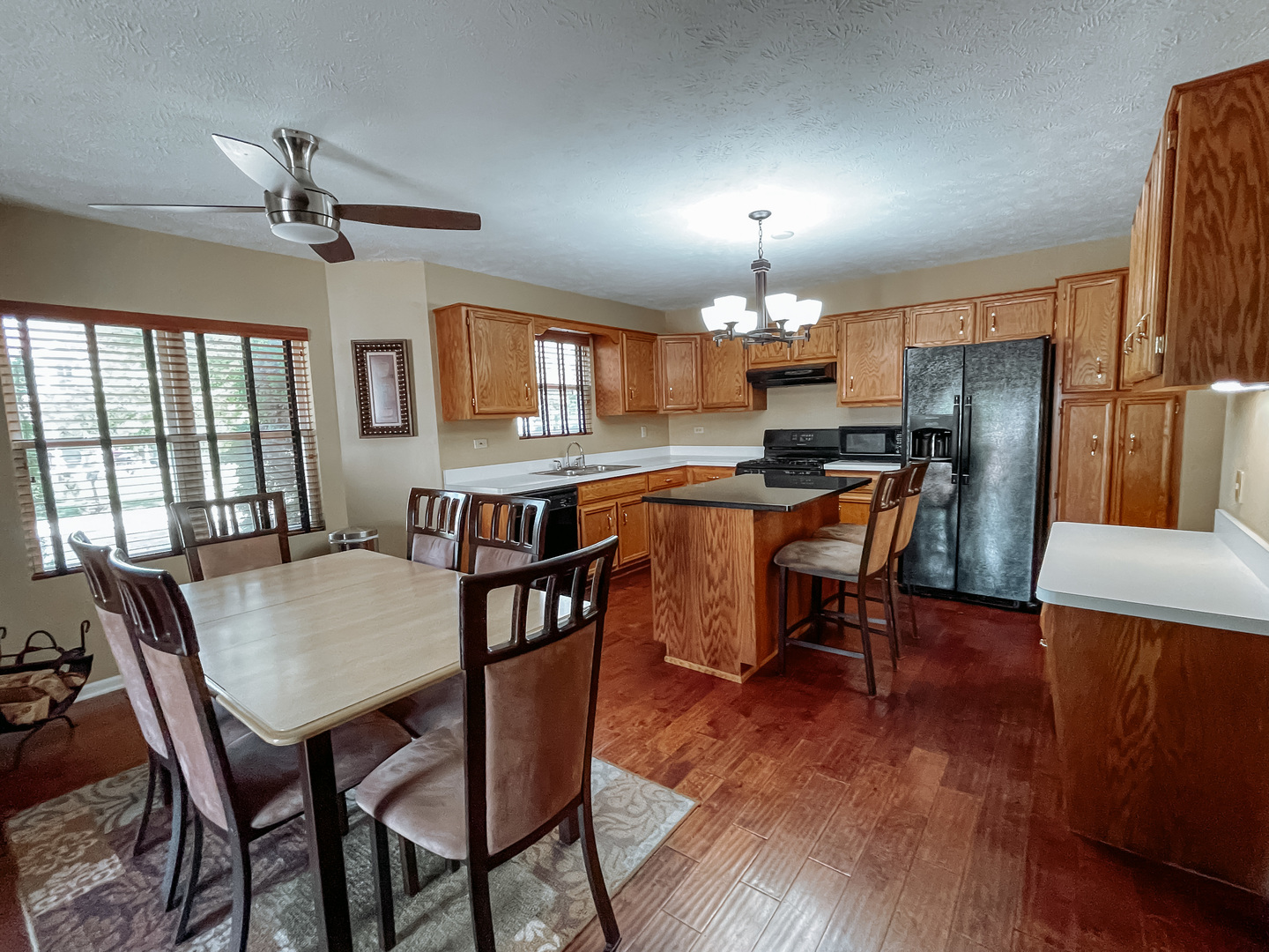 3205 Old Castle Road Joliet, IL 60431 - Photo 8 of 25 a view of a dining room with furniture and wooden floor