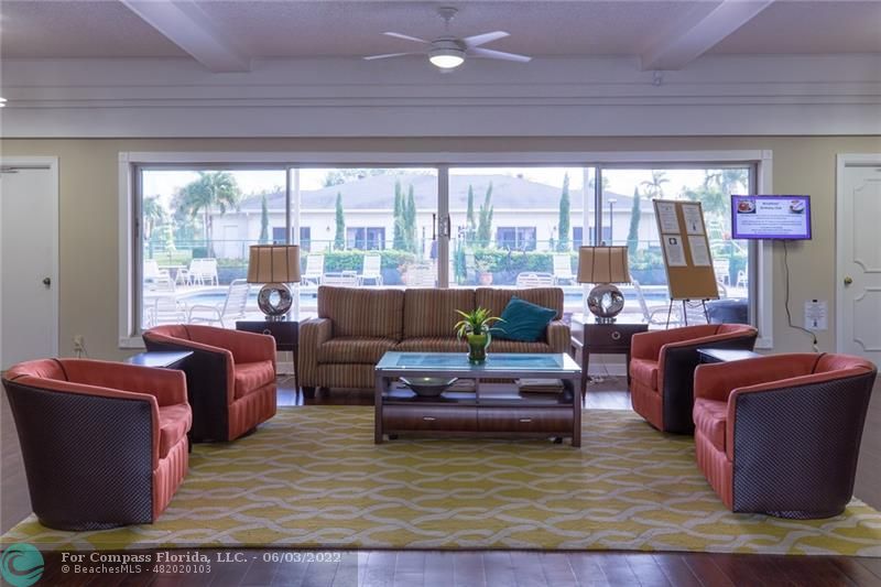Limetree Condominiums Boynton Beach, FL 33436 - Photo 11 of 22 a living room with furniture and a large window