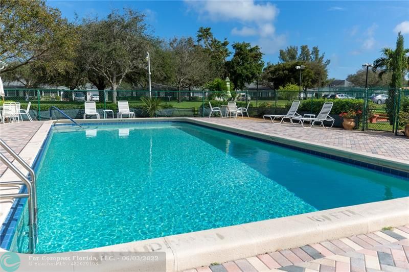 Limetree Condominiums Boynton Beach, FL 33436 - Photo 13 of 22 a view of a swimming pool with a patio