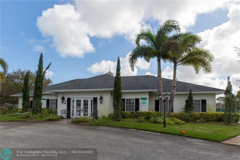 Limetree Condominiums Boynton Beach, FL 33436 - Photo 10 of 22 a front view of a house with a garden