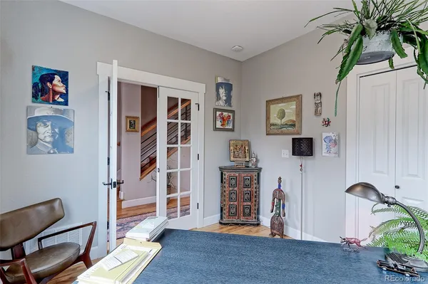 a view of a livingroom with furniture and workspace