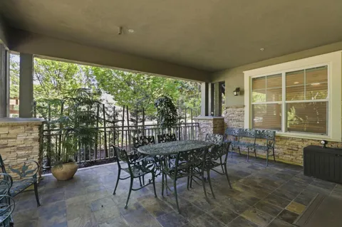 a dining room with furniture and windows