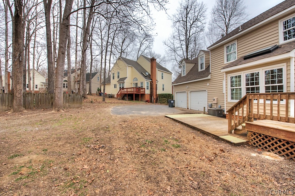 13910 Sandy Oak Road Chester, VA 23831 - Photo 5 of 32 a view of a house with a yard covered in snow