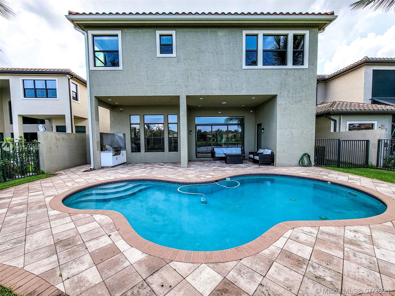 The Bridges Delray Beach, FL 33446 - Photo 8 of 61 a view of a house with swimming pool