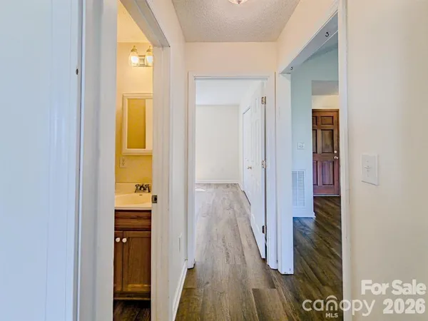 a bathroom with a toilet sink vanity tub and shower