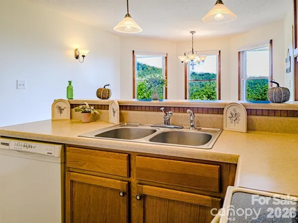 a kitchen with a sink and a window