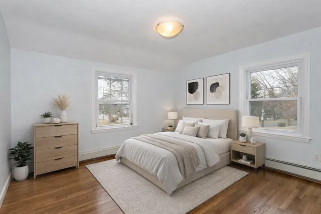 a bedroom with a bed and window