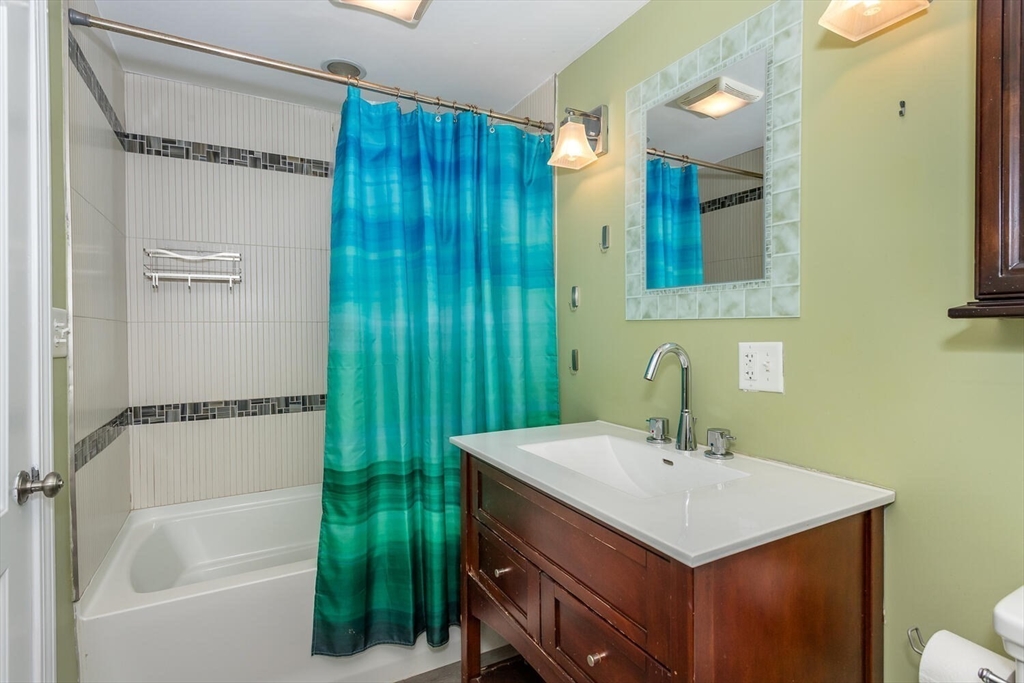 300 Chapman Street Canton, MA 02021 - Photo 13 of 16 a bathroom with a sink and a mirror