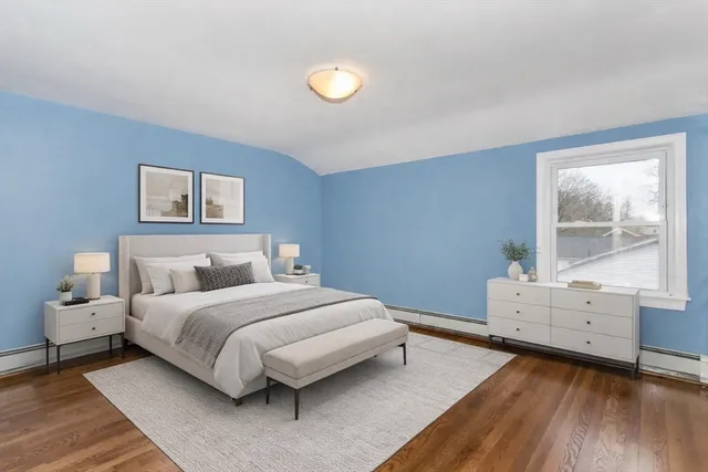 a bedroom with a bed and window