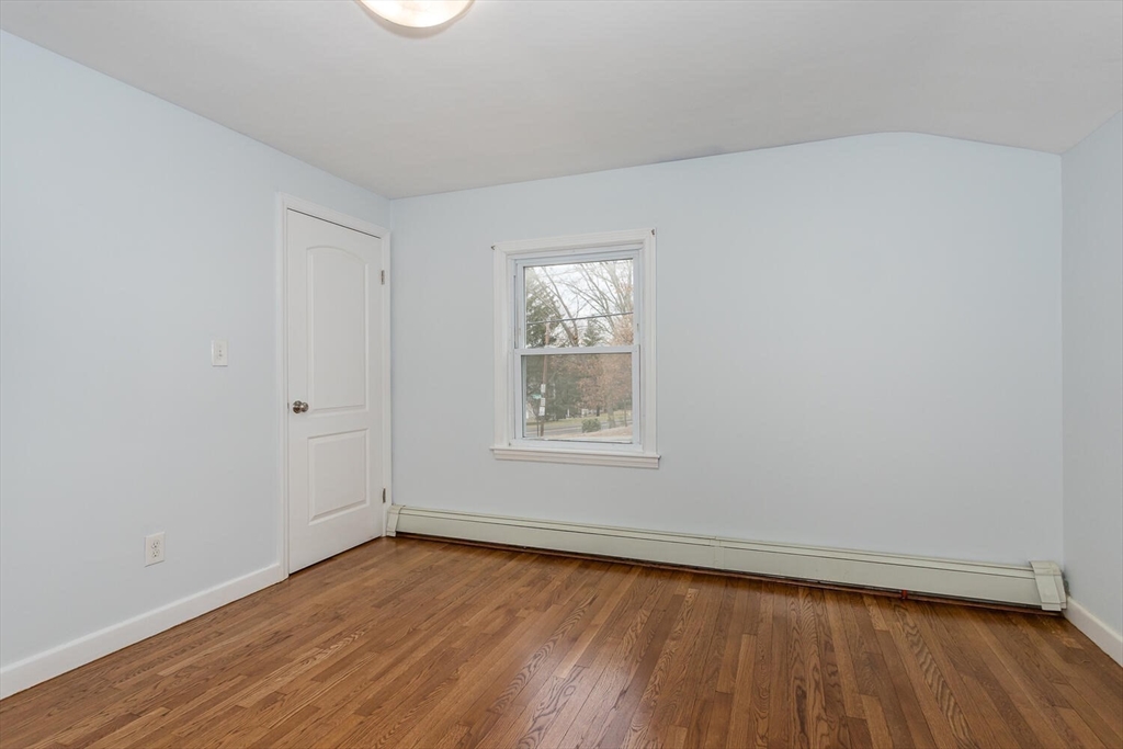 300 Chapman Street Canton, MA 02021 - Photo 8 of 16 an empty room with wooden floor and windows