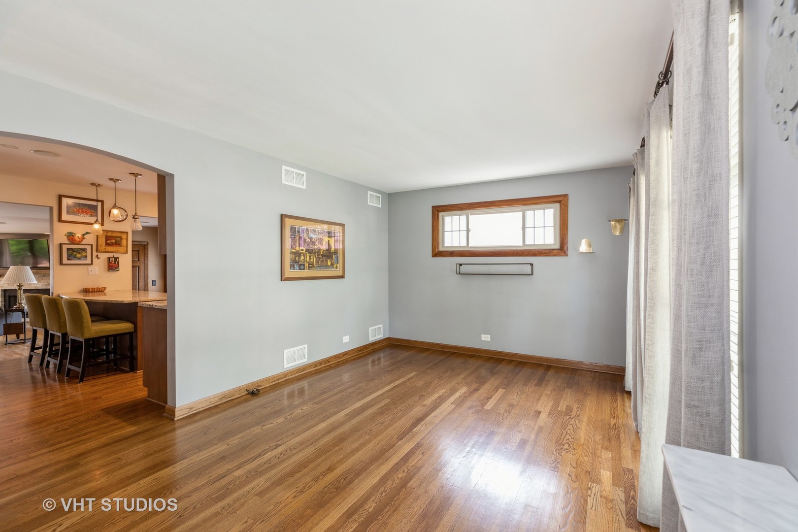 18633 Golfview Avenue Homewood, IL 60430 - Photo 2 of 18 an empty room with wooden floor and windows