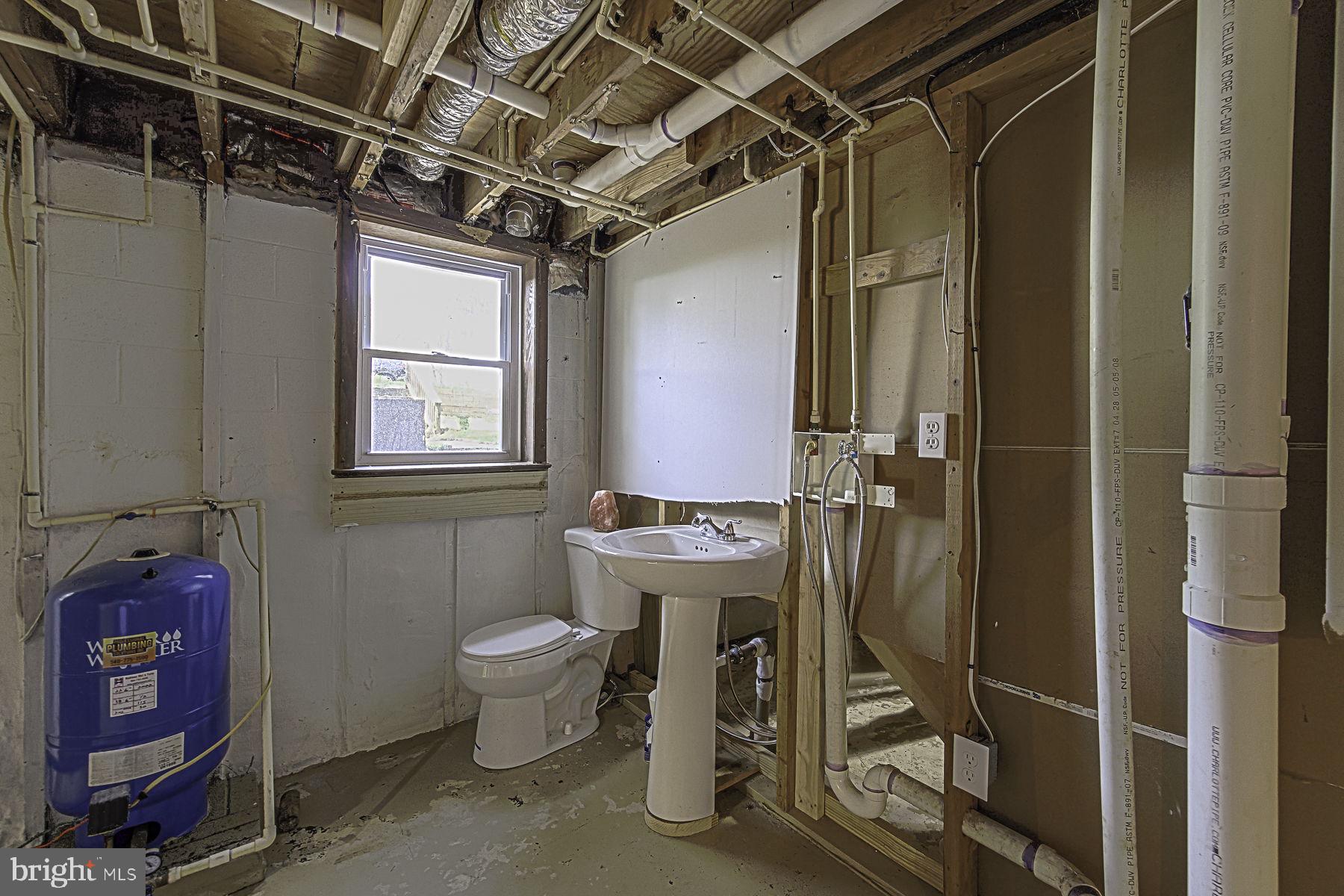 20121 Sparta Road Milford, VA 22514 - Photo 26 of 31 Renovation-ready basement bathroom space.