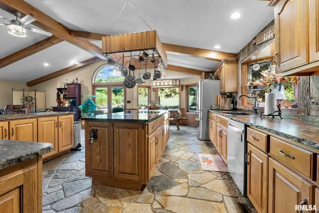 a view of a swimming pool with a yard and plants