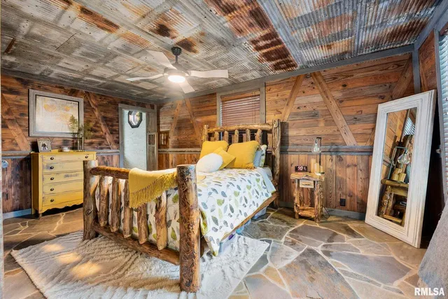 a view of a garden with plants and large trees