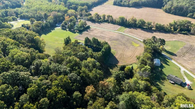 a view of a house with a yard and a garage