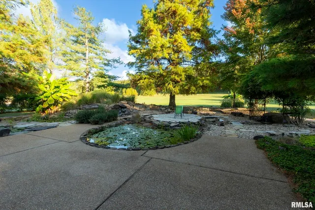a backyard of a house with yard and outdoor seating