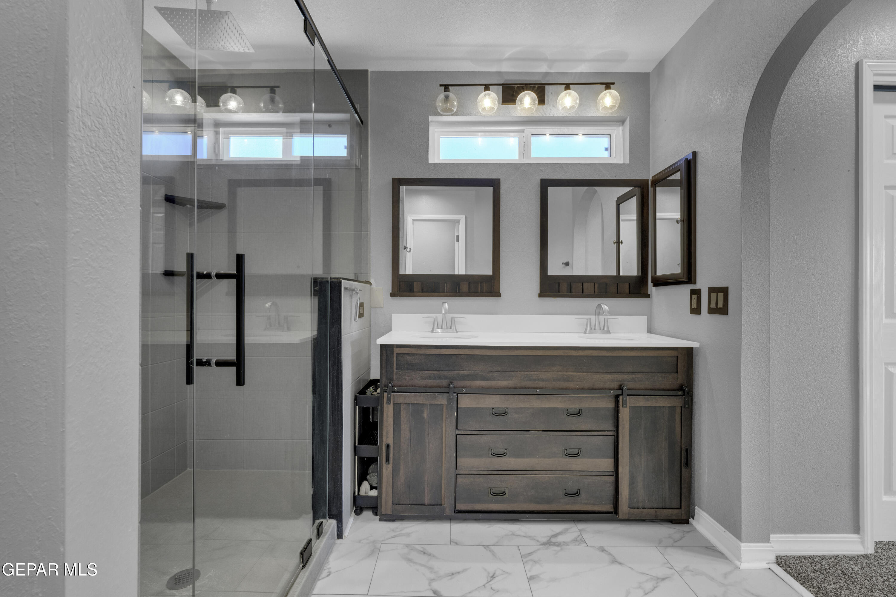6341 Cougar Ridge Lane El Paso, TX 79912 - Photo 11 of 71 a bathroom with a granite countertop sink and a mirror