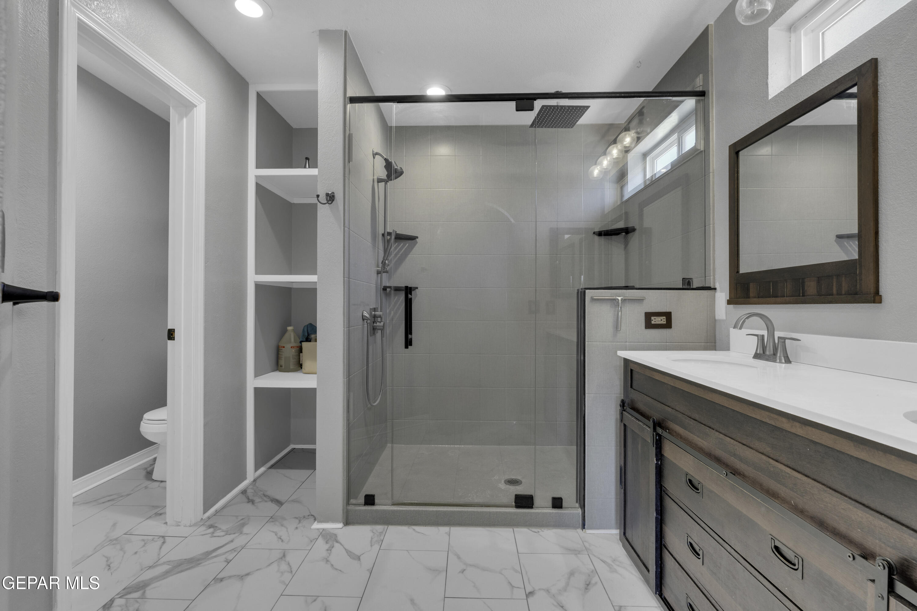 6341 Cougar Ridge Lane El Paso, TX 79912 - Photo 47 of 71 a bathroom with a sink a toilet and shower