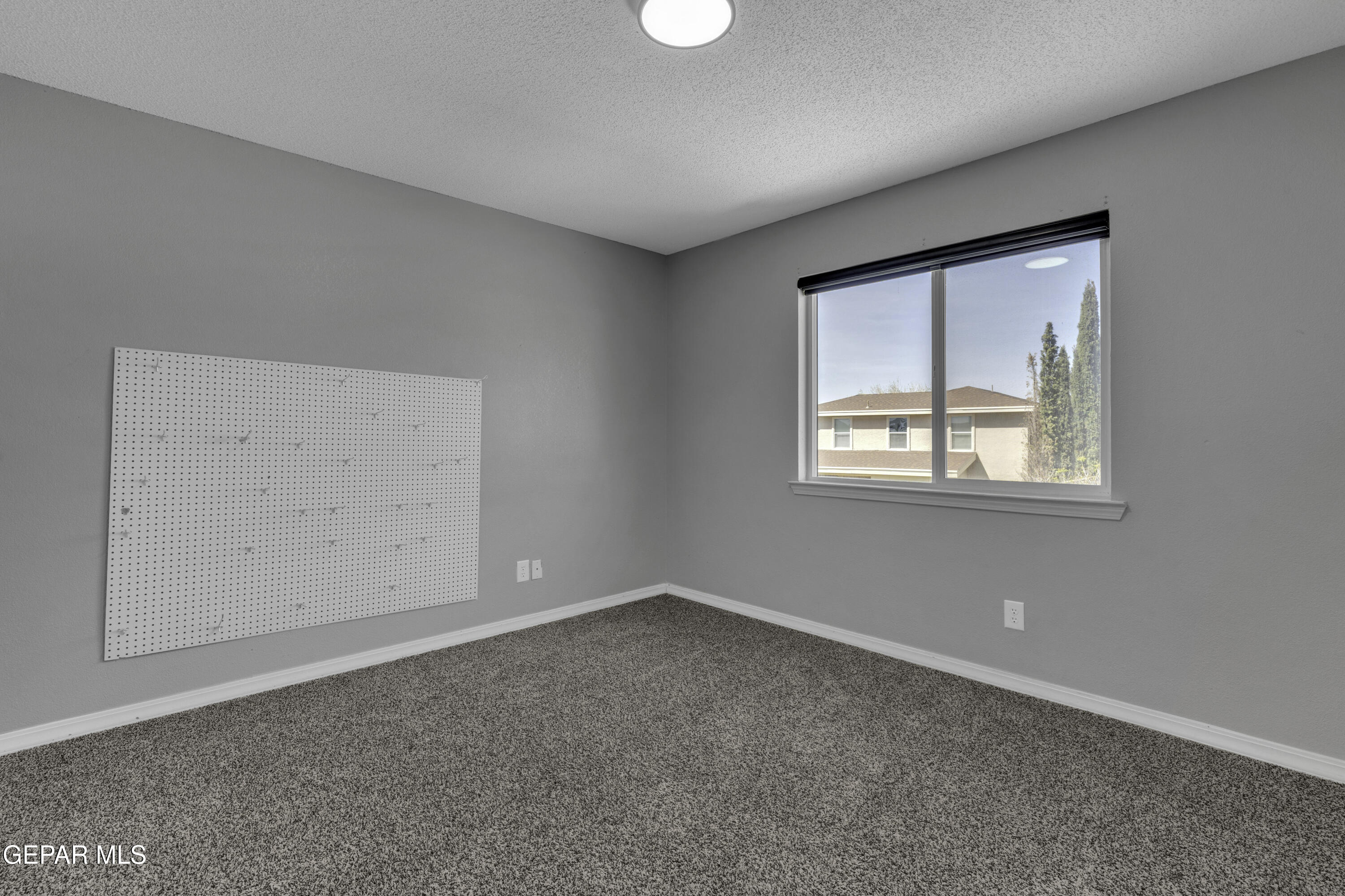 6341 Cougar Ridge Lane El Paso, TX 79912 - Photo 53 of 71 an empty room with a window