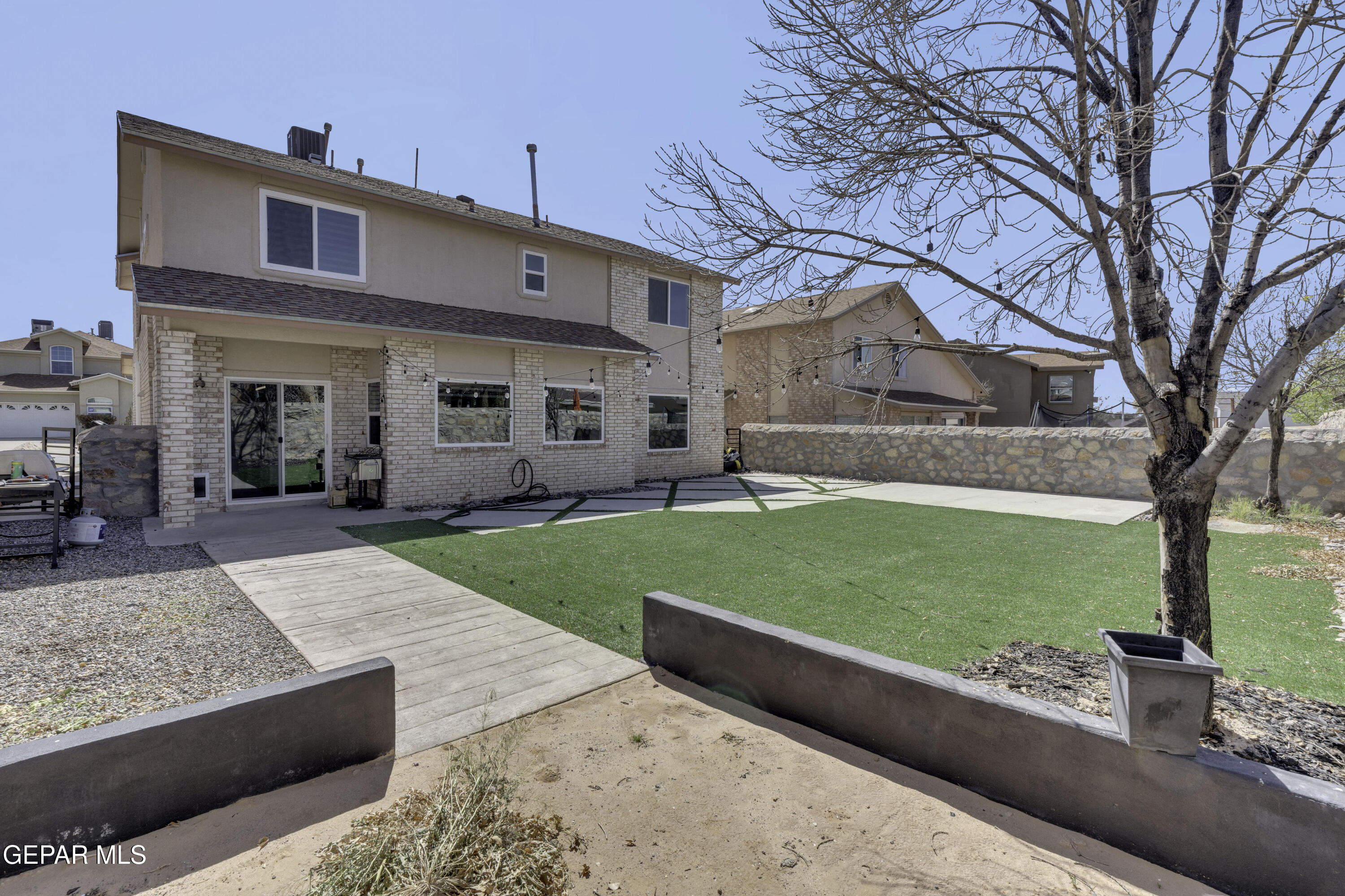 6341 Cougar Ridge Lane El Paso, TX 79912 - Photo 58 of 71 a front view of a house with a garden and plants