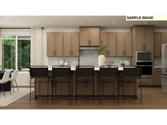 a open kitchen with stainless steel appliances kitchen island granite countertop a table and chairs