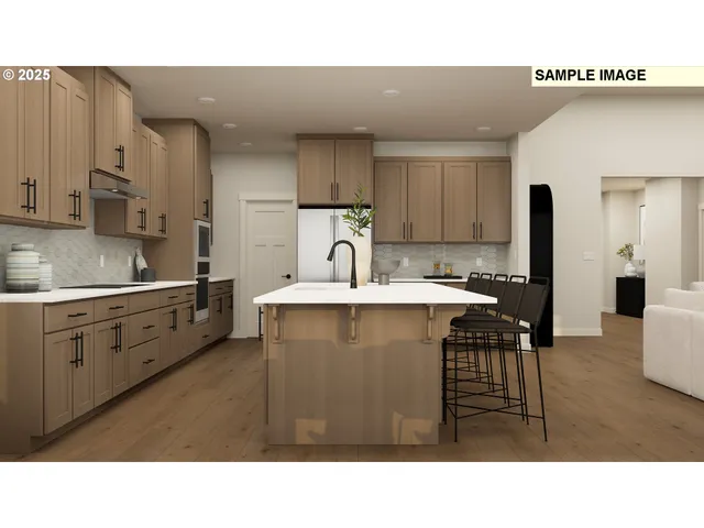 a kitchen with a sink refrigerator and cabinets