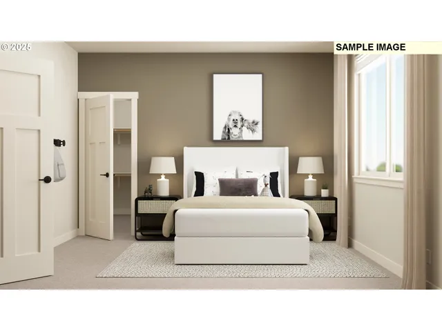 a living room with a bed furniture and a window