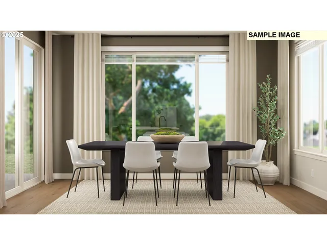 a dining room with furniture and a large window