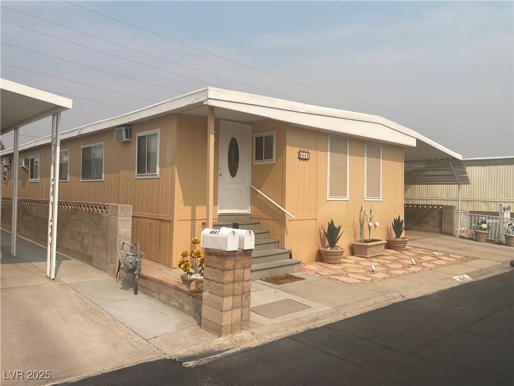 4641 Royal Ridge Boulevard Las Vegas, NV 89103 - Photo 1 of 38 Manufactured / mobile home with entry steps and driveway