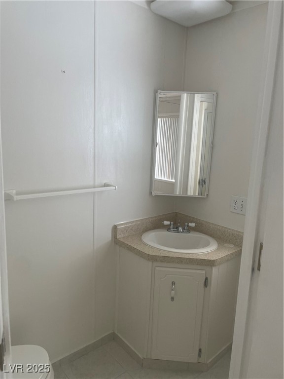 4641 Royal Ridge Boulevard Las Vegas, NV 89103 - Photo 26 of 38 Half bathroom with vanity and toilet