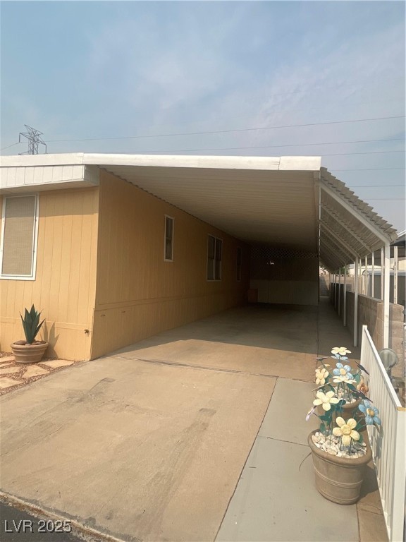 4641 Royal Ridge Boulevard Las Vegas, NV 89103 - Photo 3 of 38 Manufactured / mobile home with an attached carport and concrete driveway
