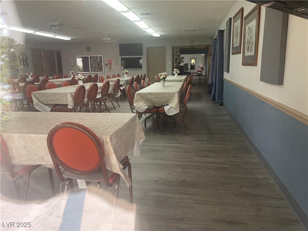 4641 Royal Ridge Boulevard Las Vegas, NV 89103 - Photo 38 of 38 Dining area featuring wood finished floors, a ceiling fan, and a textured ceiling