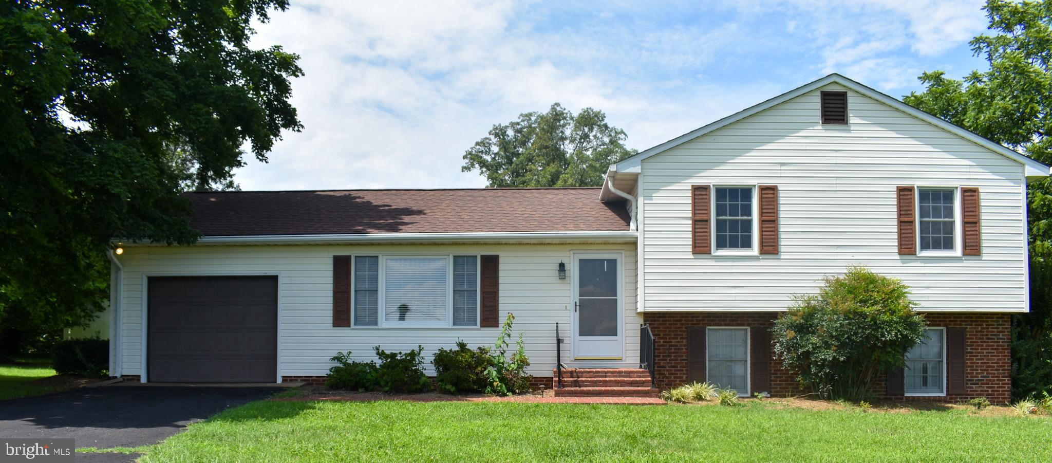 15650 Gibson Mill Road Culpeper, VA 22701 - Photo 2 of 28 Charming split-level home with lush greenery.